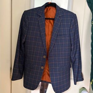 A. Dong Tailoring Blazer, would best fit a men’s S or up to women’s M